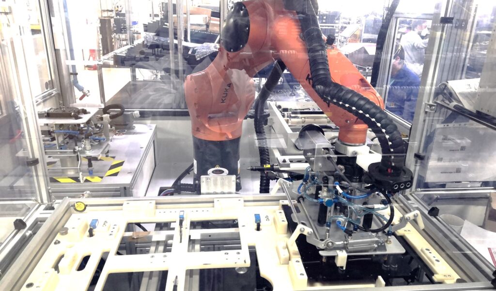 Robot cell for automated electronics assembly